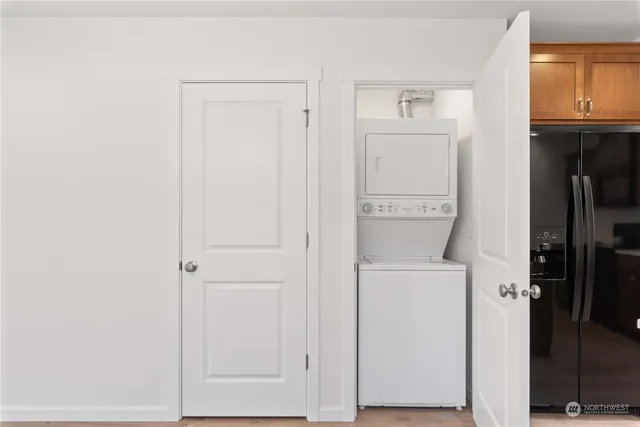 a utility room with closet dryer and washer