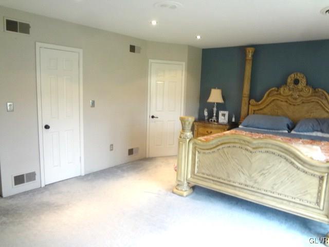 416 Bushkill Center Road Nazareth, PA 18064 - Photo 23 of 50 a bedroom with a bed and a lamp