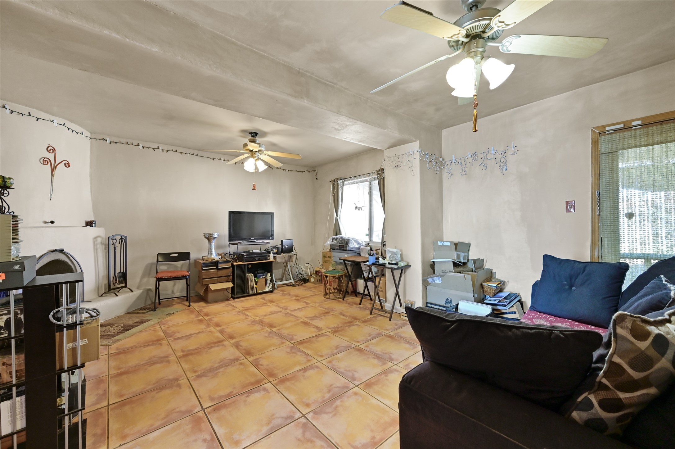 2829 Siringo Road Santa Fe, NM 87507 - Photo 12 of 18 Den with fireplace