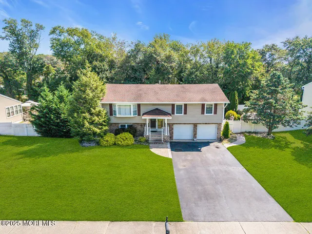a aerial view of a house with a big yard