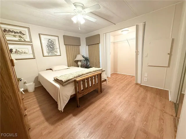 a spacious bedroom with a bed and a table