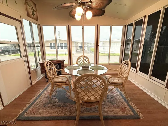 a view of a dining room with furniture window and outside view