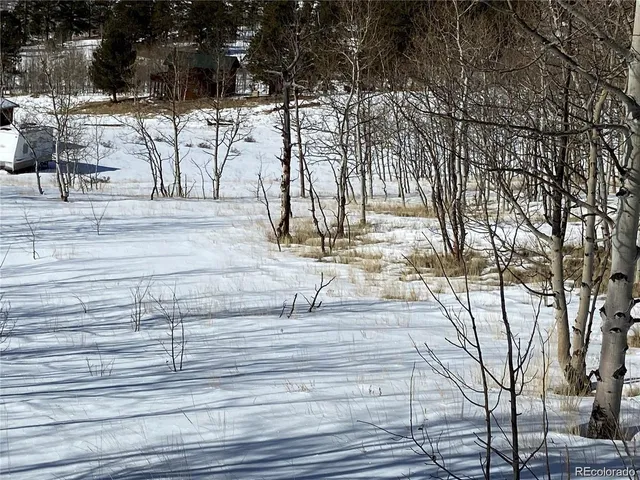 a view of a backyard of the house