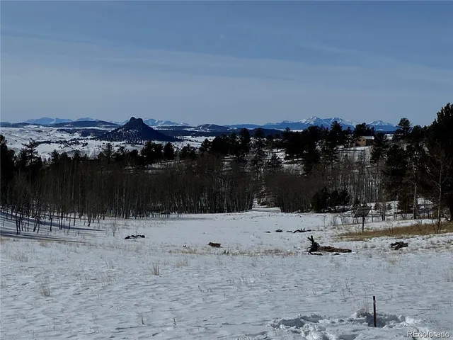a view of a lake with a yard