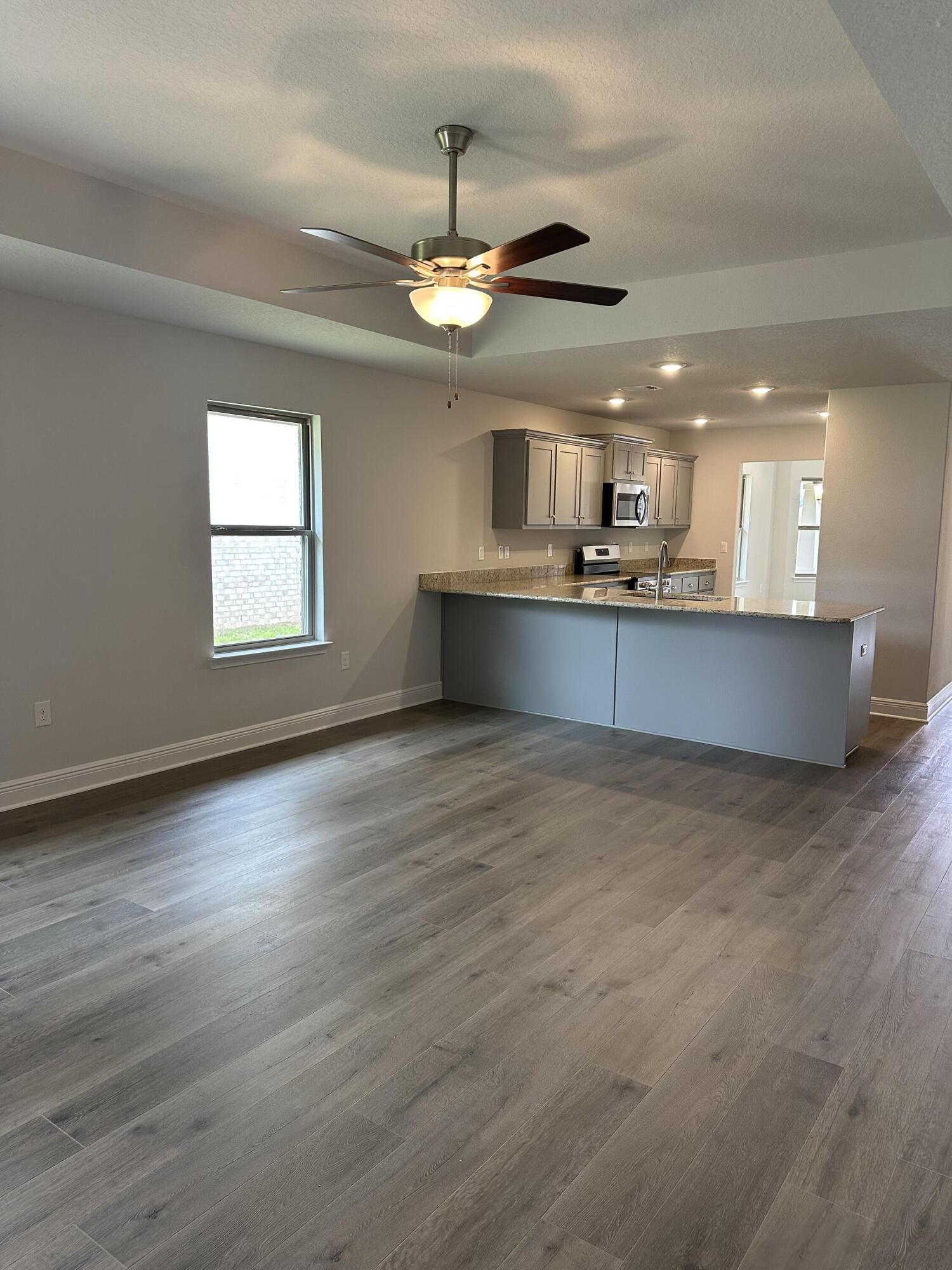 187 Ridgeway Circle Crestview, FL 32536 - Photo 13 of 22 a view of a kitchen and a chandelier fan