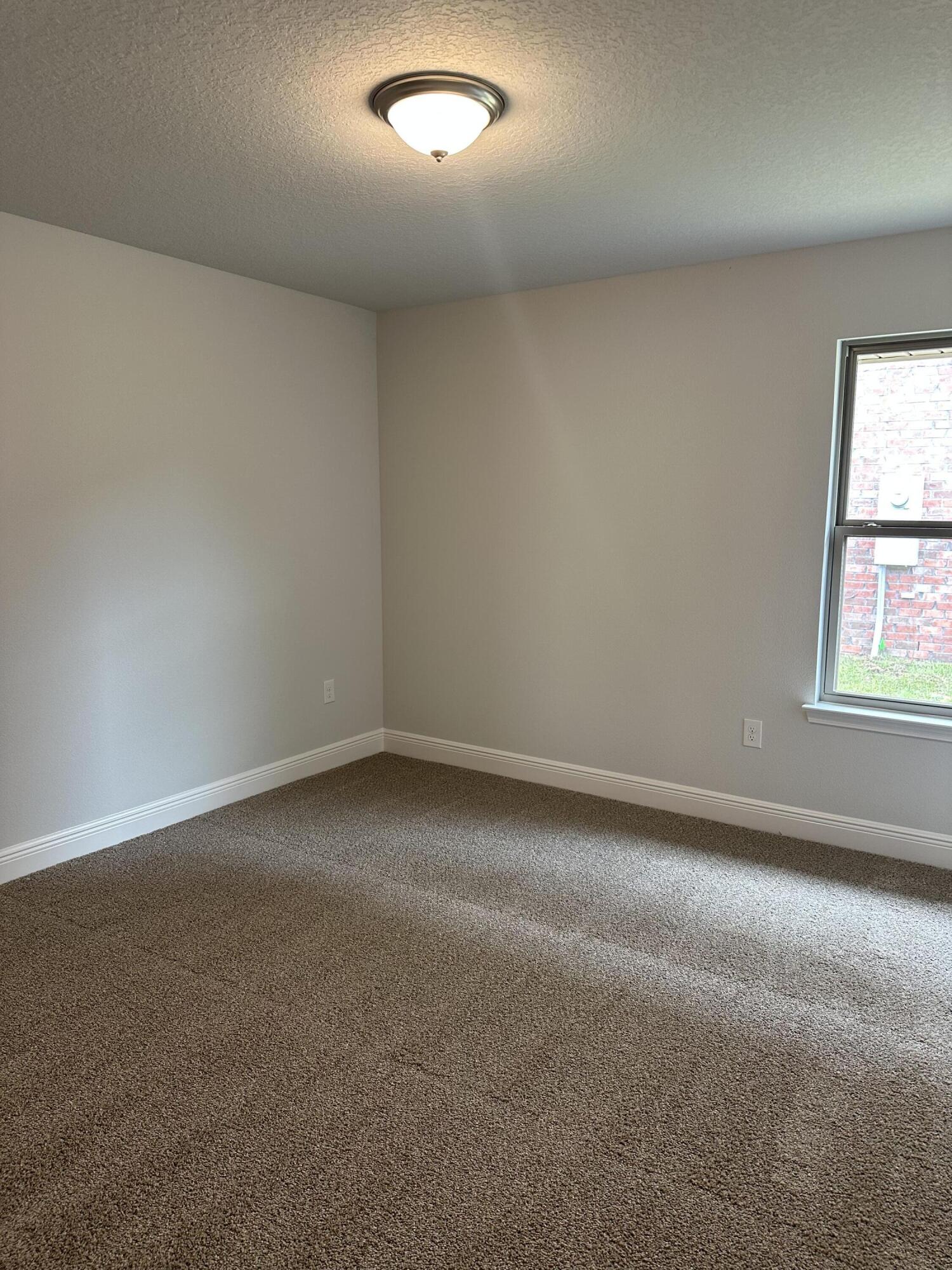 187 Ridgeway Circle Crestview, FL 32536 - Photo 14 of 22 an empty room with a window