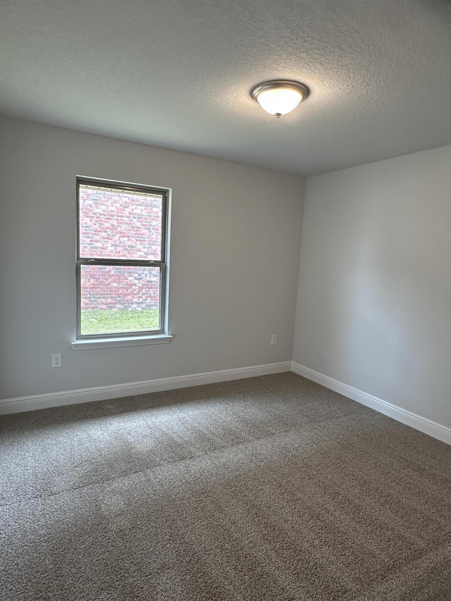 187 Ridgeway Circle Crestview, FL 32536 - Photo 15 of 22 an empty room with a window