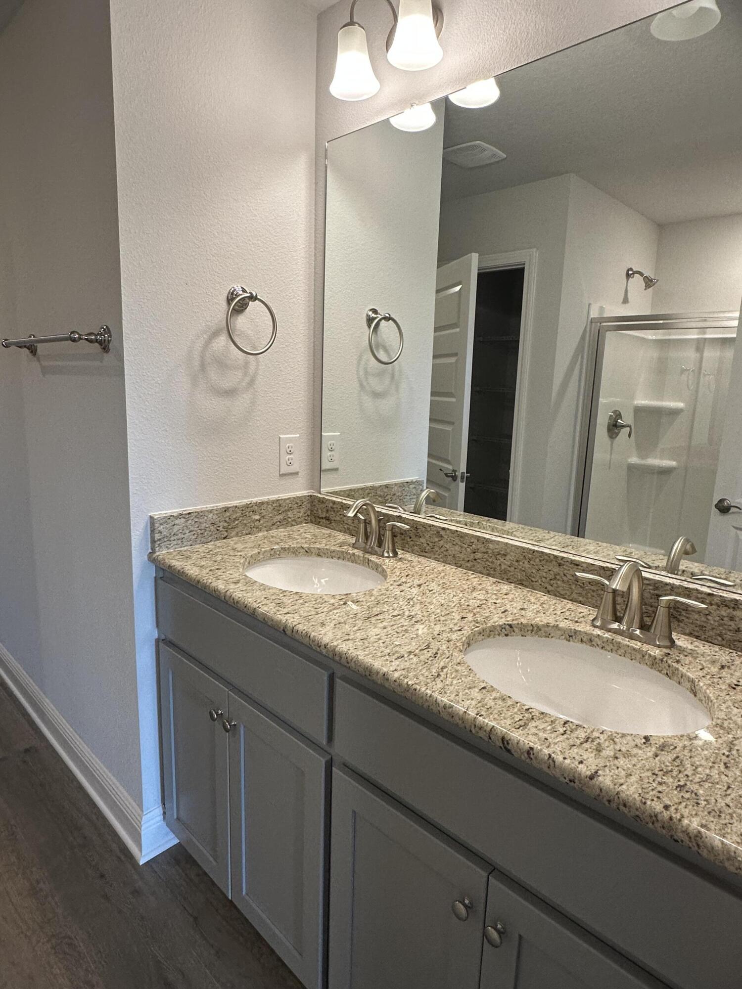 187 Ridgeway Circle Crestview, FL 32536 - Photo 18 of 22 a bathroom with a granite countertop sink and a mirror