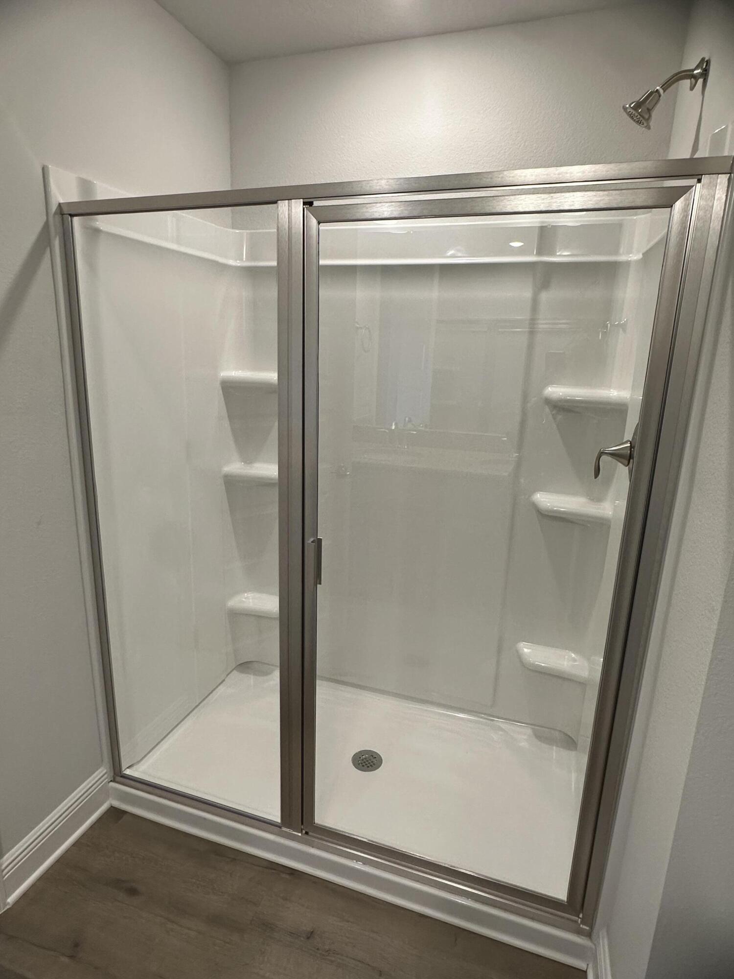 187 Ridgeway Circle Crestview, FL 32536 - Photo 19 of 22 a bathroom with a glass shower door