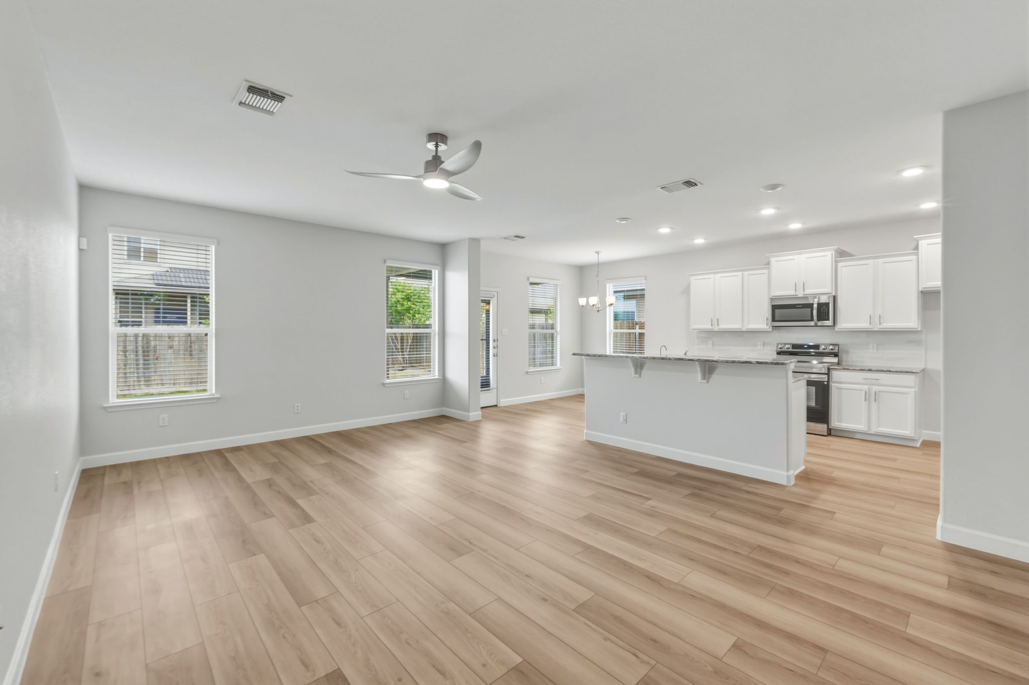 a view of kitchen with wooden floor and window