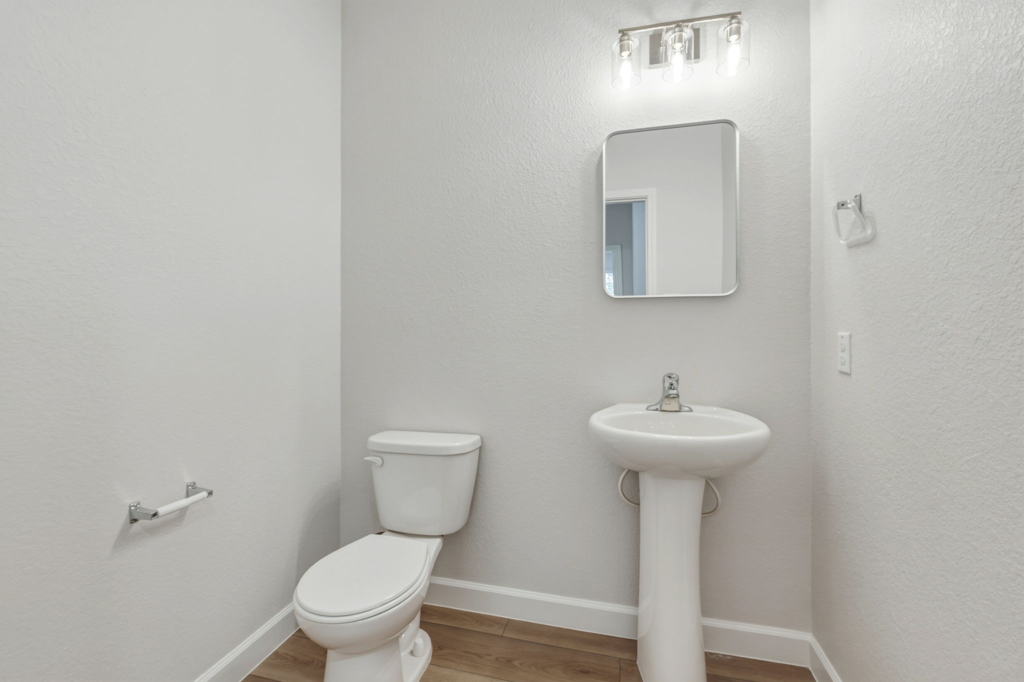 301 Serpentine Lane Jarrell, TX 76537 - Photo 13 of 39 a bathroom with a toilet sink and mirror