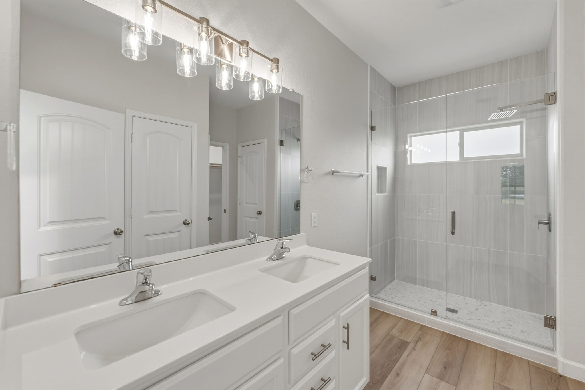301 Serpentine Lane Jarrell, TX 76537 - Photo 18 of 39 a bathroom with a sink a shower and a mirror