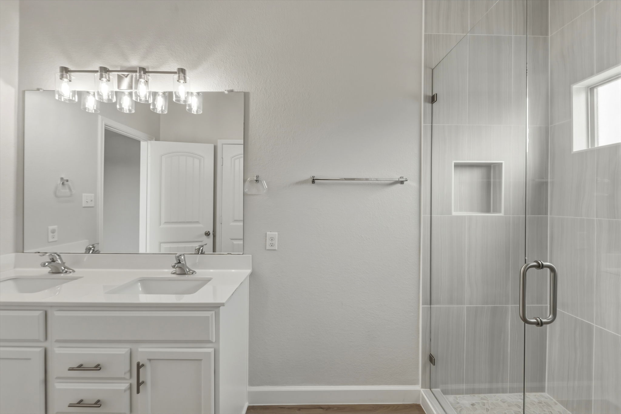 301 Serpentine Lane Jarrell, TX 76537 - Photo 19 of 39 a bathroom with a sink shower and a mirror