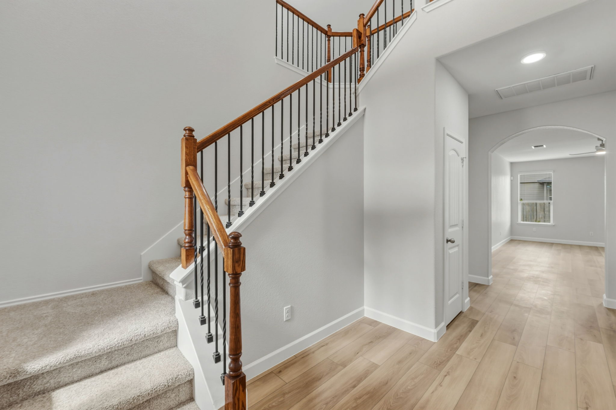 301 Serpentine Lane Jarrell, TX 76537 - Photo 22 of 39 a view of staircase with wooden floor and fan