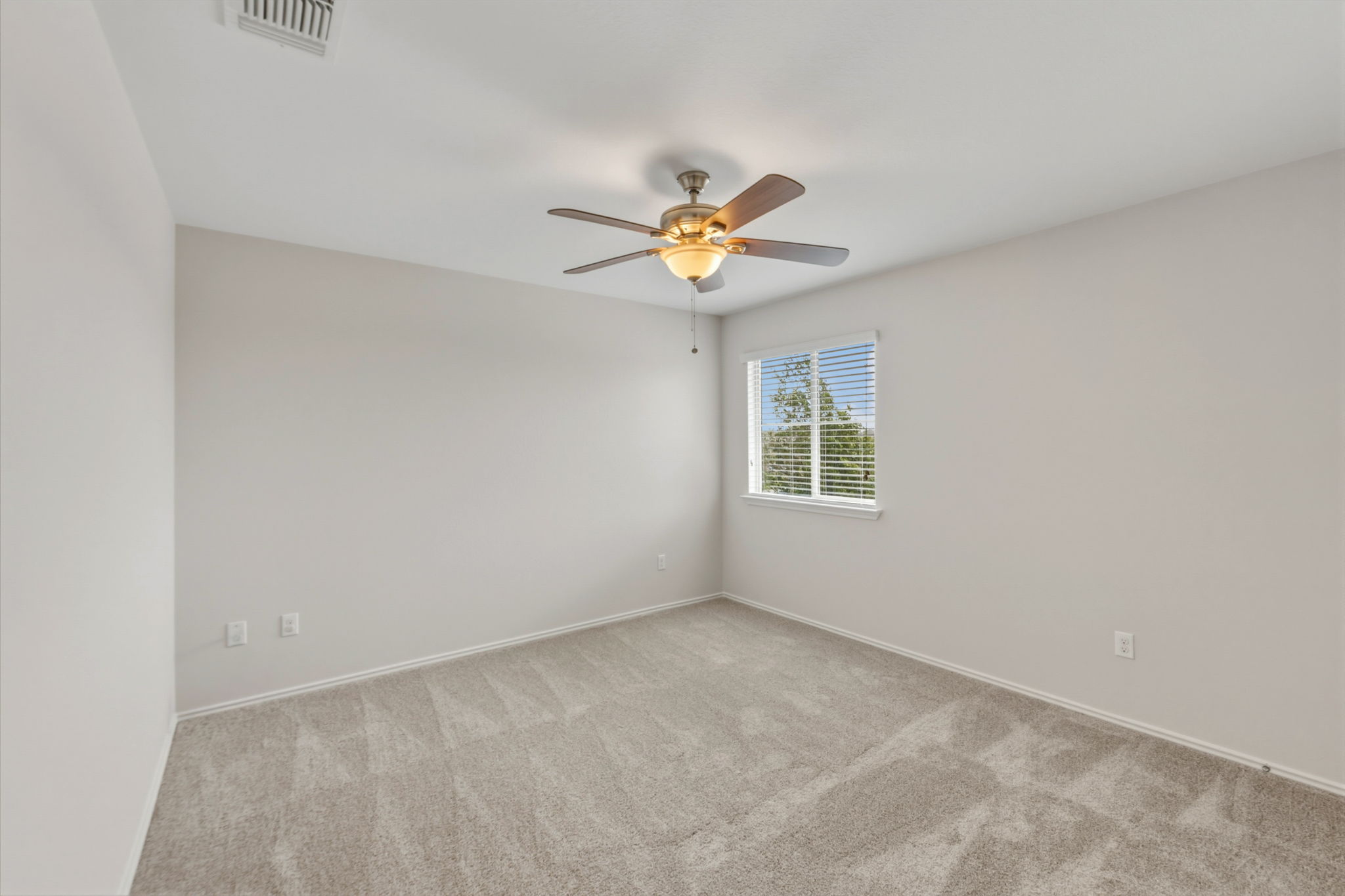 301 Serpentine Lane Jarrell, TX 76537 - Photo 27 of 39 an empty room with a window and a fan