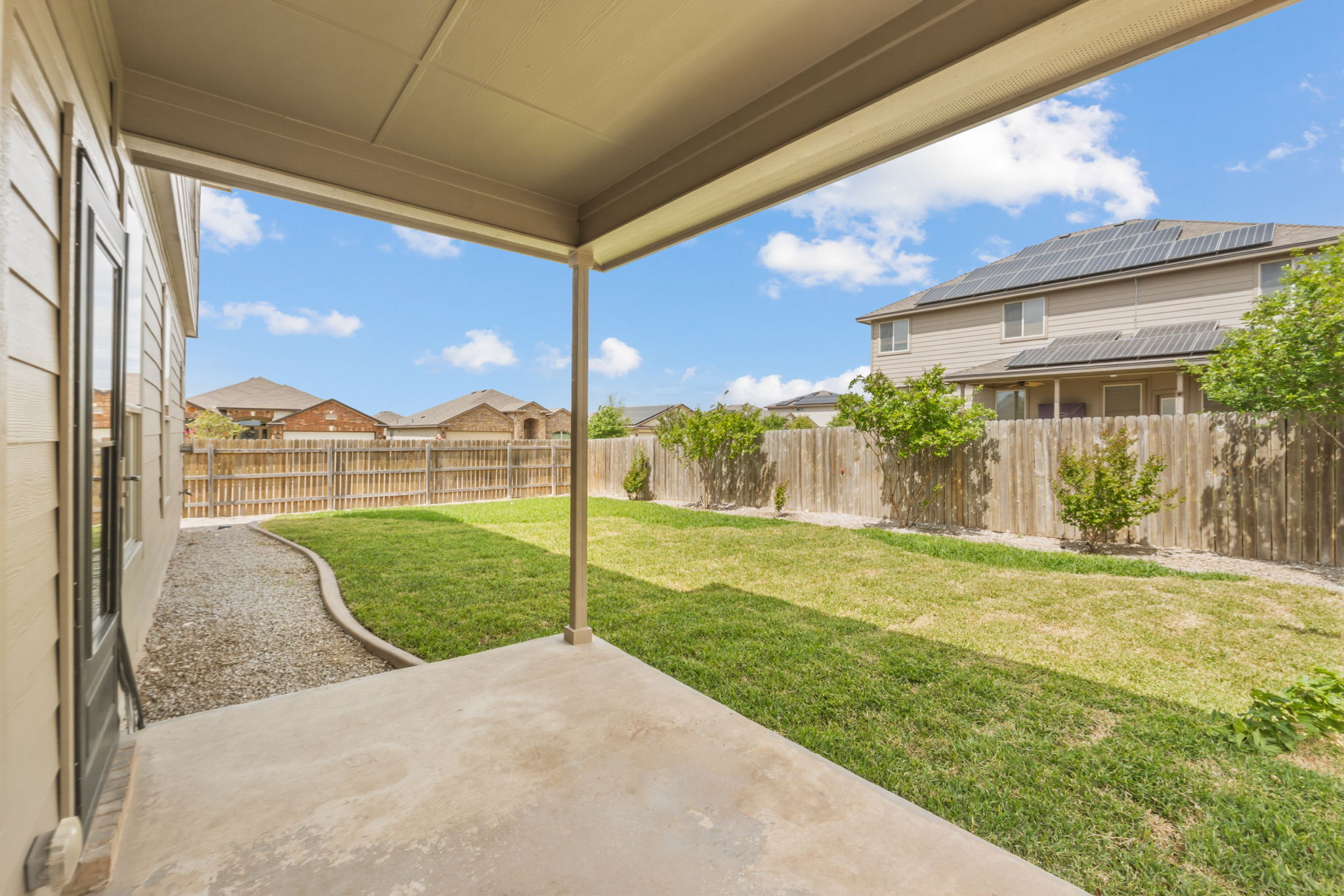 301 Serpentine Lane Jarrell, TX 76537 - Photo 32 of 39 a view of a porch with a big yard