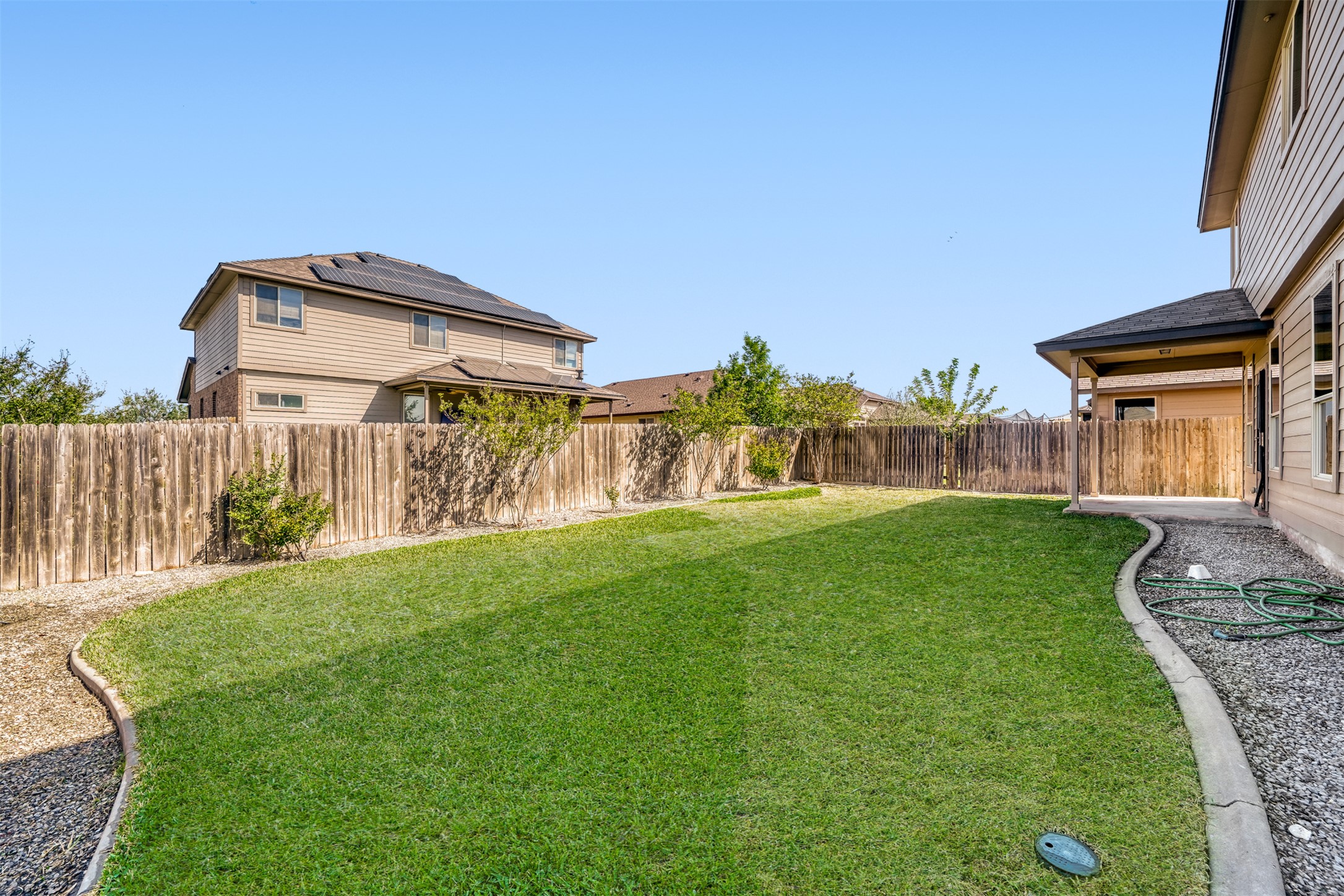 301 Serpentine Lane Jarrell, TX 76537 - Photo 33 of 39 a front view of a house with garden
