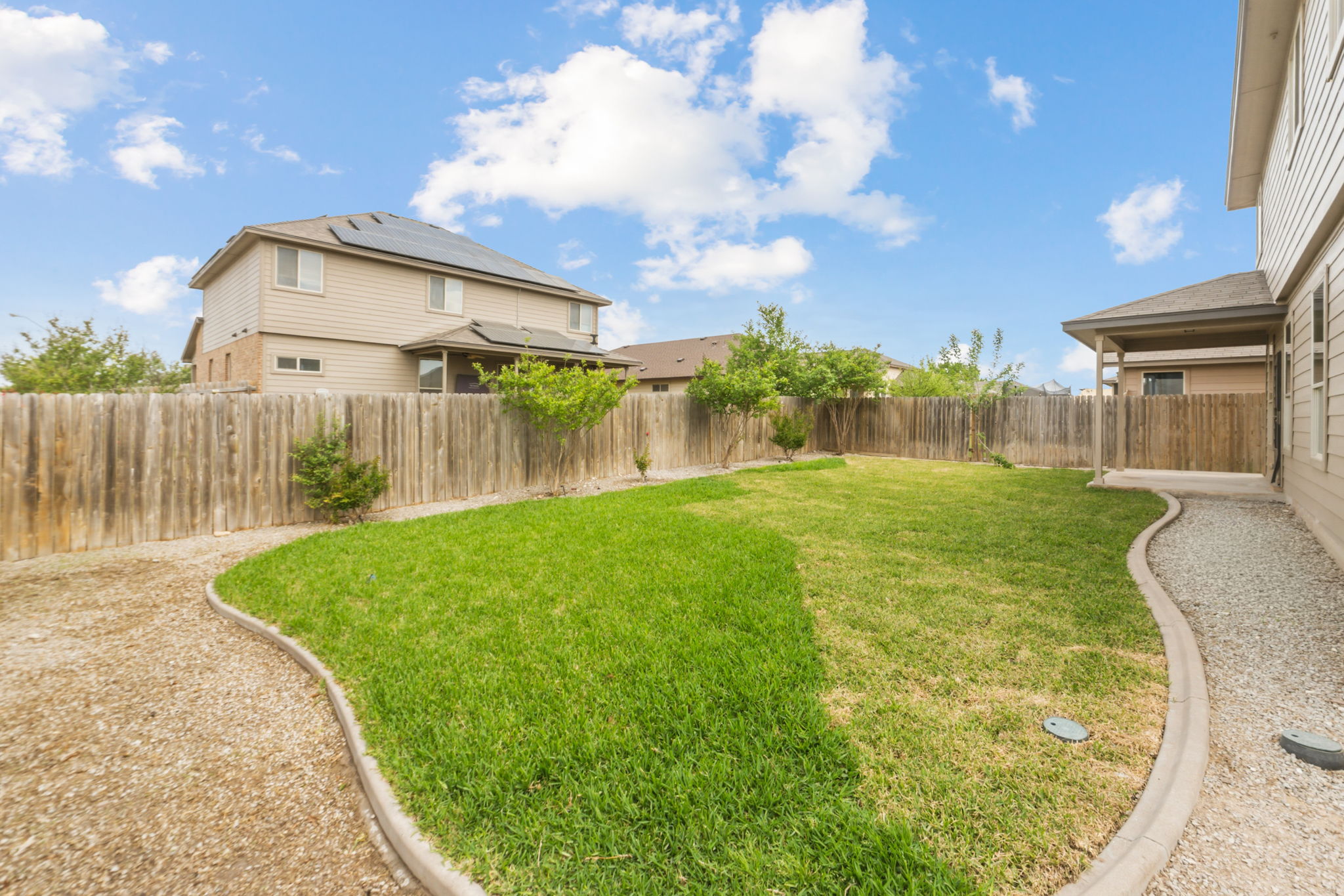 301 Serpentine Lane Jarrell, TX 76537 - Photo 37 of 39 a view of a house with a big yard and a large tree