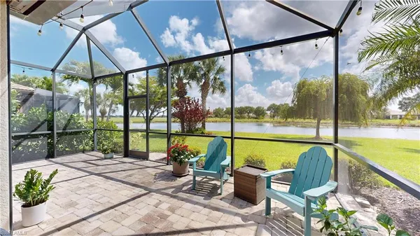 a view of swimming pool with outdoor seating