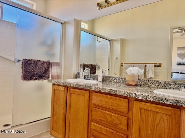 1147 White Oak Loop Minden, NV 89423 - Photo 12 of 23 a bathroom with a granite countertop sink and a mirror