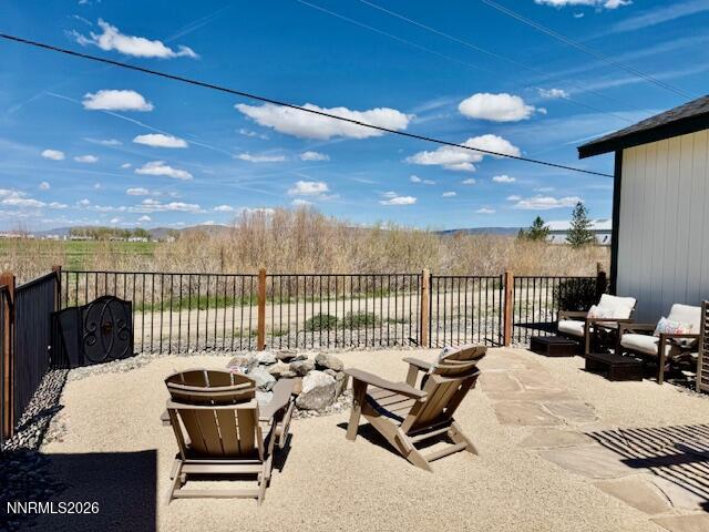 1147 White Oak Loop Minden, NV 89423 - Photo 19 of 23 a roof deck with a table and chairs