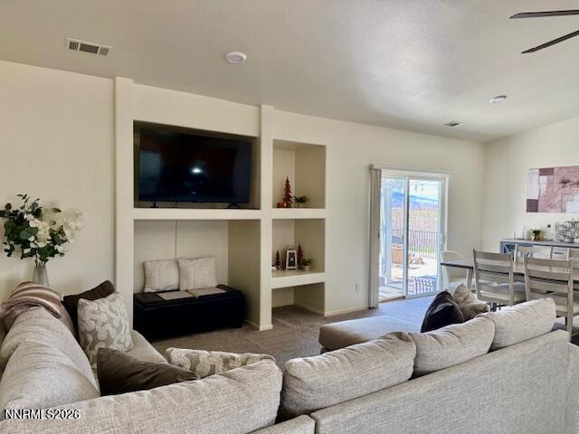 1147 White Oak Loop Minden, NV 89423 - Photo 3 of 23 a living room with furniture and a flat screen tv