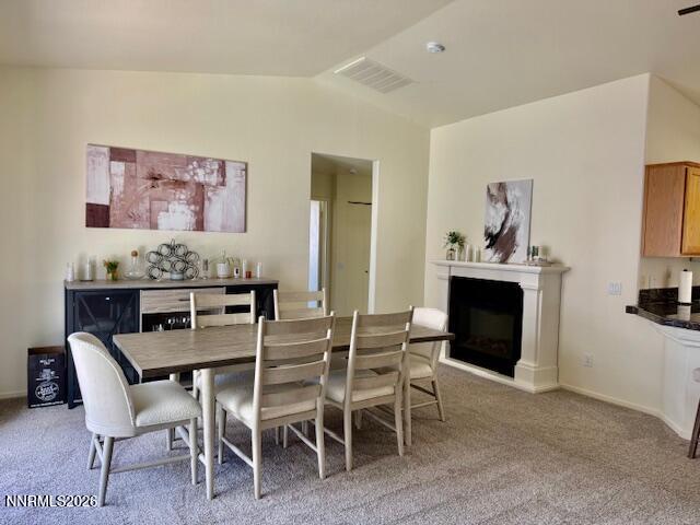 1147 White Oak Loop Minden, NV 89423 - Photo 6 of 23 a dining room with furniture and a fireplace