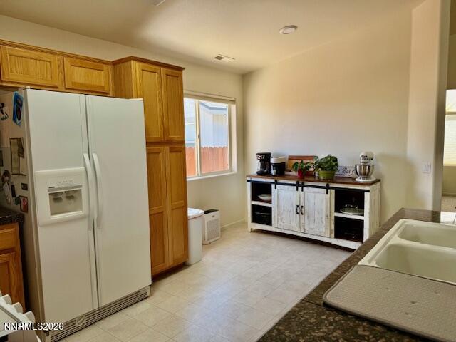 1147 White Oak Loop Minden, NV 89423 - Photo 9 of 23 a kitchen with stainless steel appliances a refrigerator and a stove