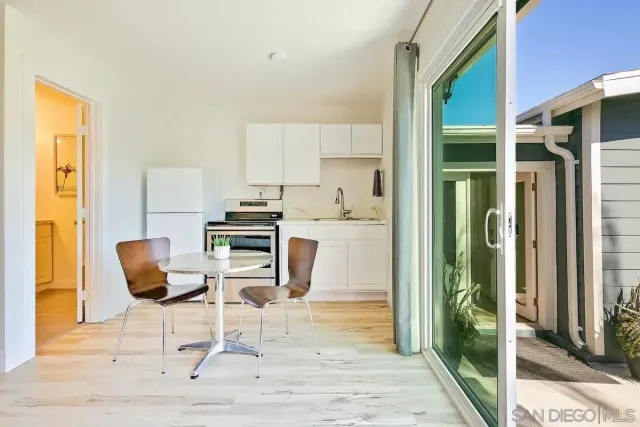a bathroom with a toilet a sink and a mirror
