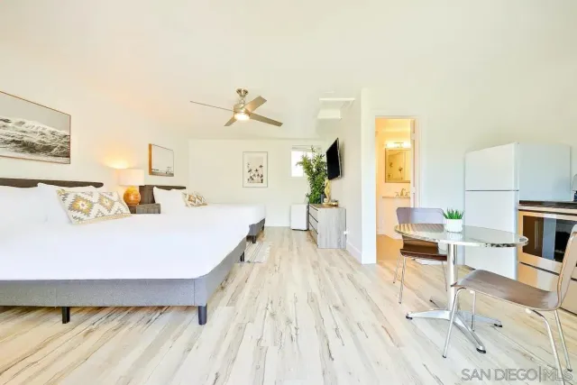a bathroom with a sink mirror vanity and toilet