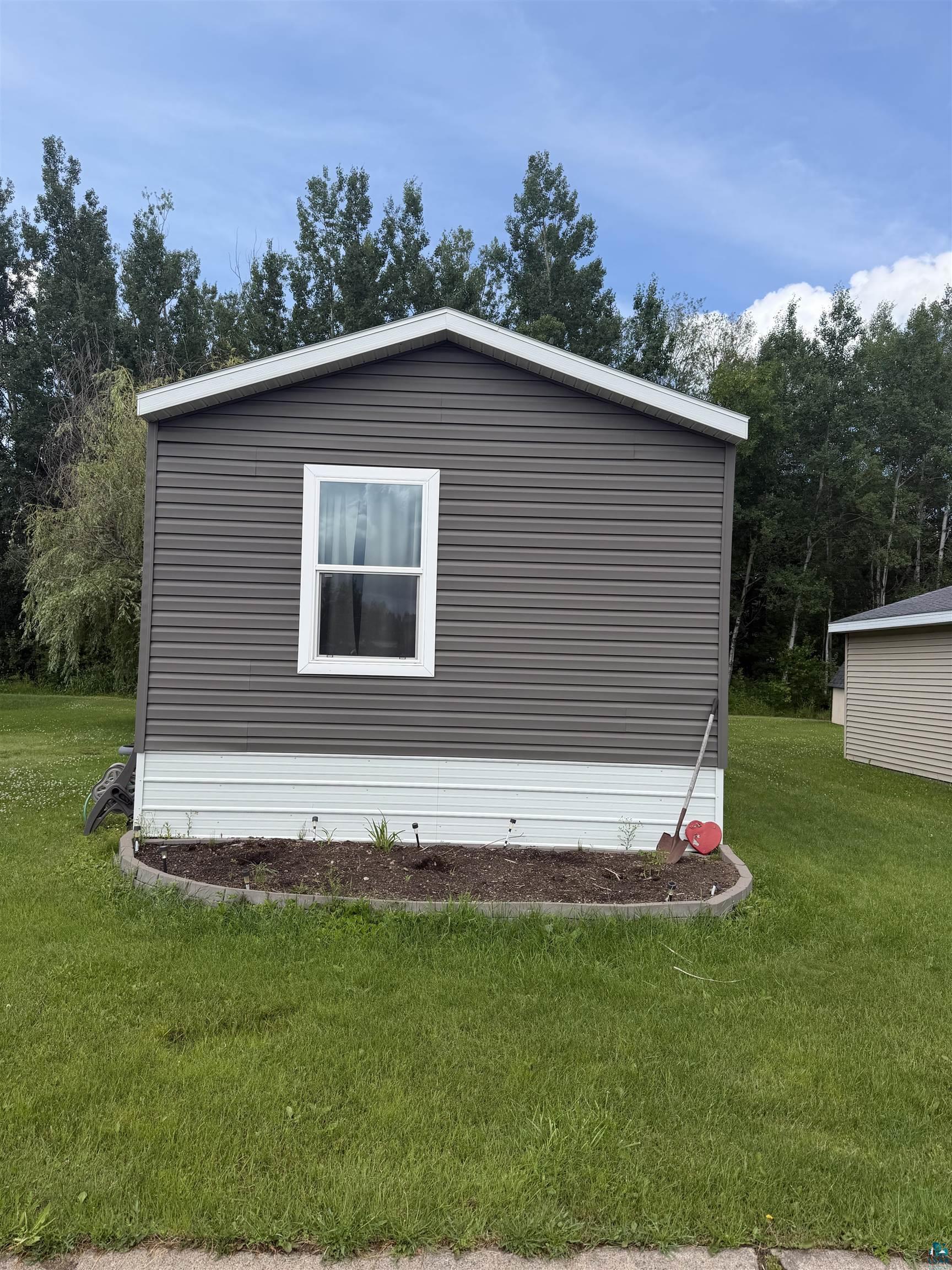 5051 Alpine Drive Hermantown, MN 55811 - Photo 2 of 24 Contemporary single-pane window set within horizontal siding