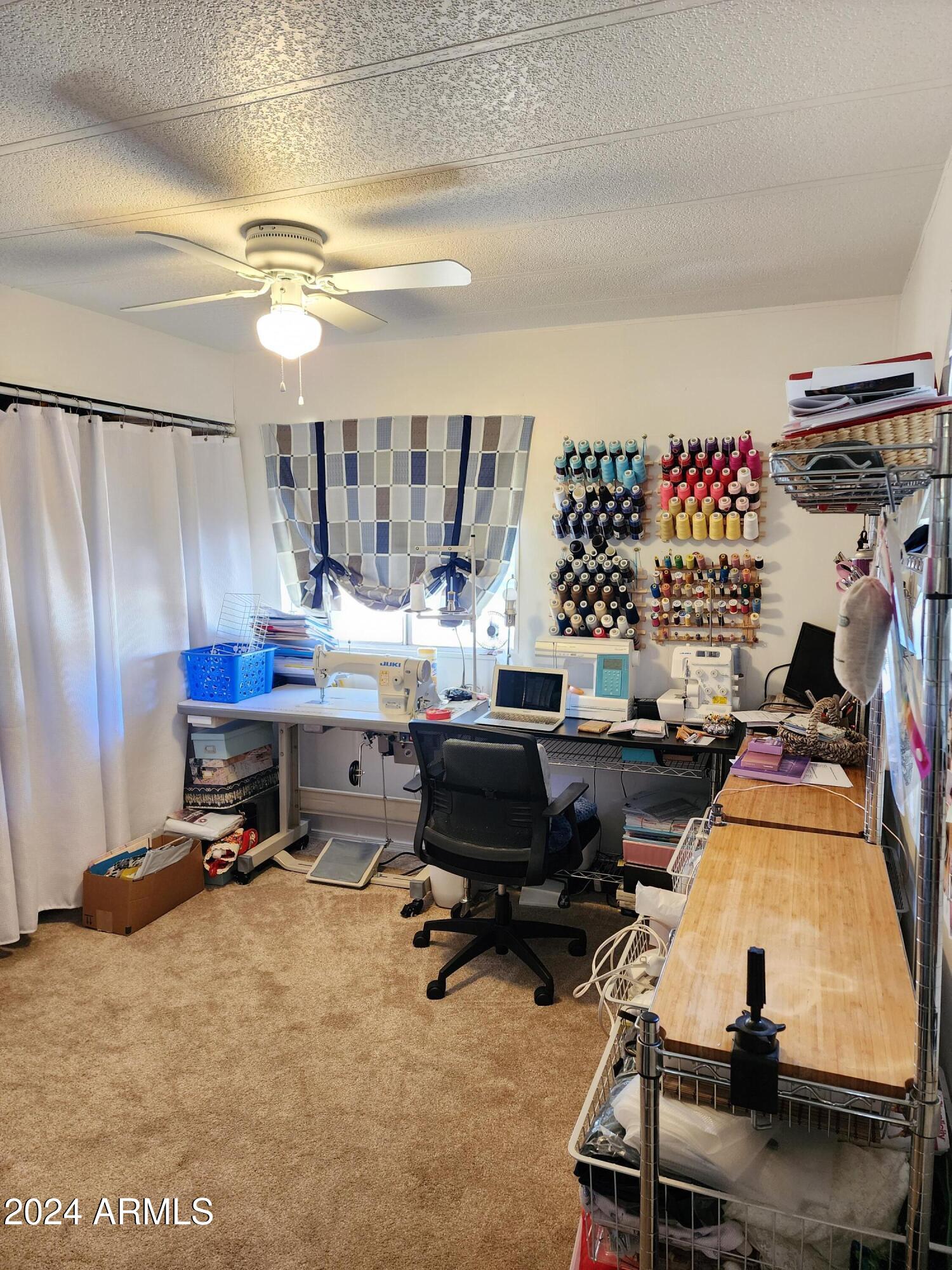 16005 North 32nd Street, Unit 33 Phoenix, AZ 85032 - Photo 22 of 40 a room with gym equipment and a view of living room