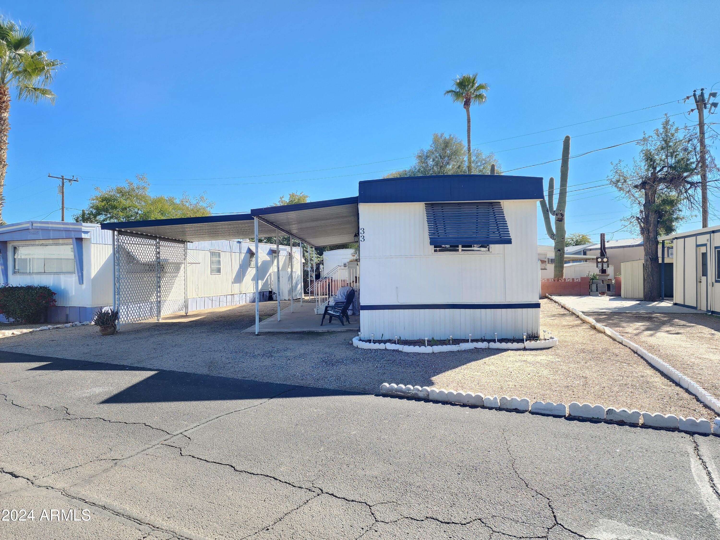 16005 North 32nd Street, Unit 33 Phoenix, AZ 85032 - Photo 3 of 40 a view of a terrace with a bench