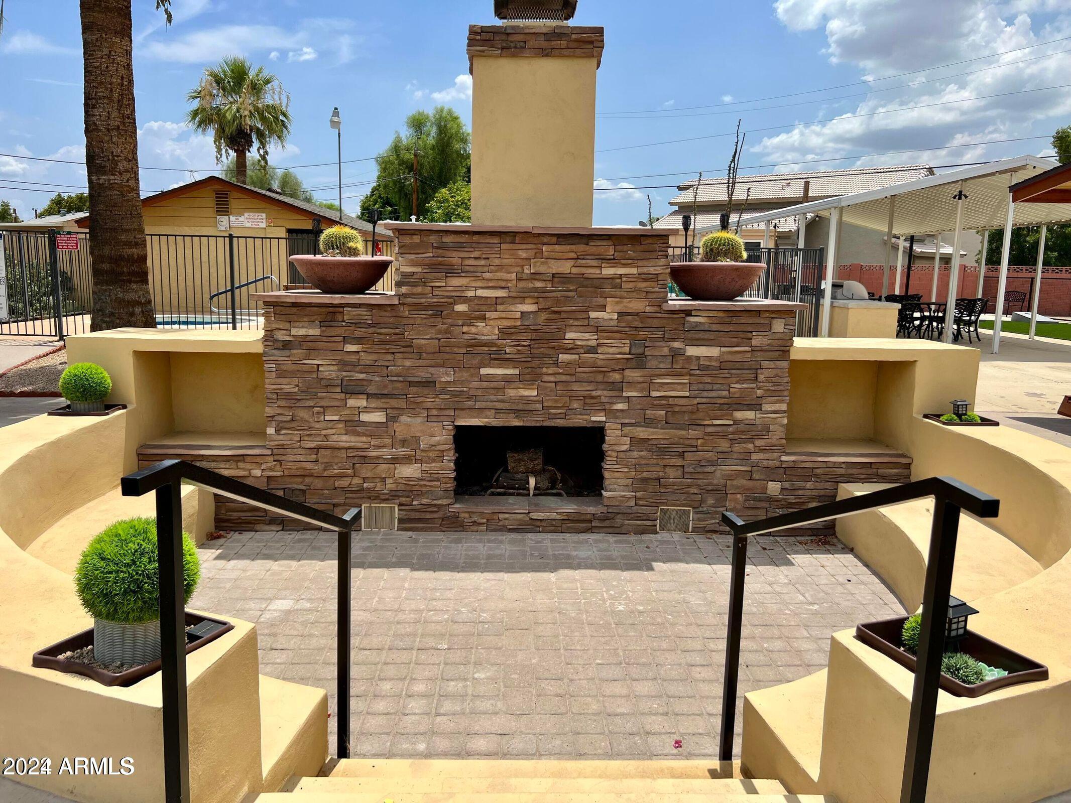 16005 North 32nd Street, Unit 33 Phoenix, AZ 85032 - Photo 35 of 40 a view of a terrace with seating area