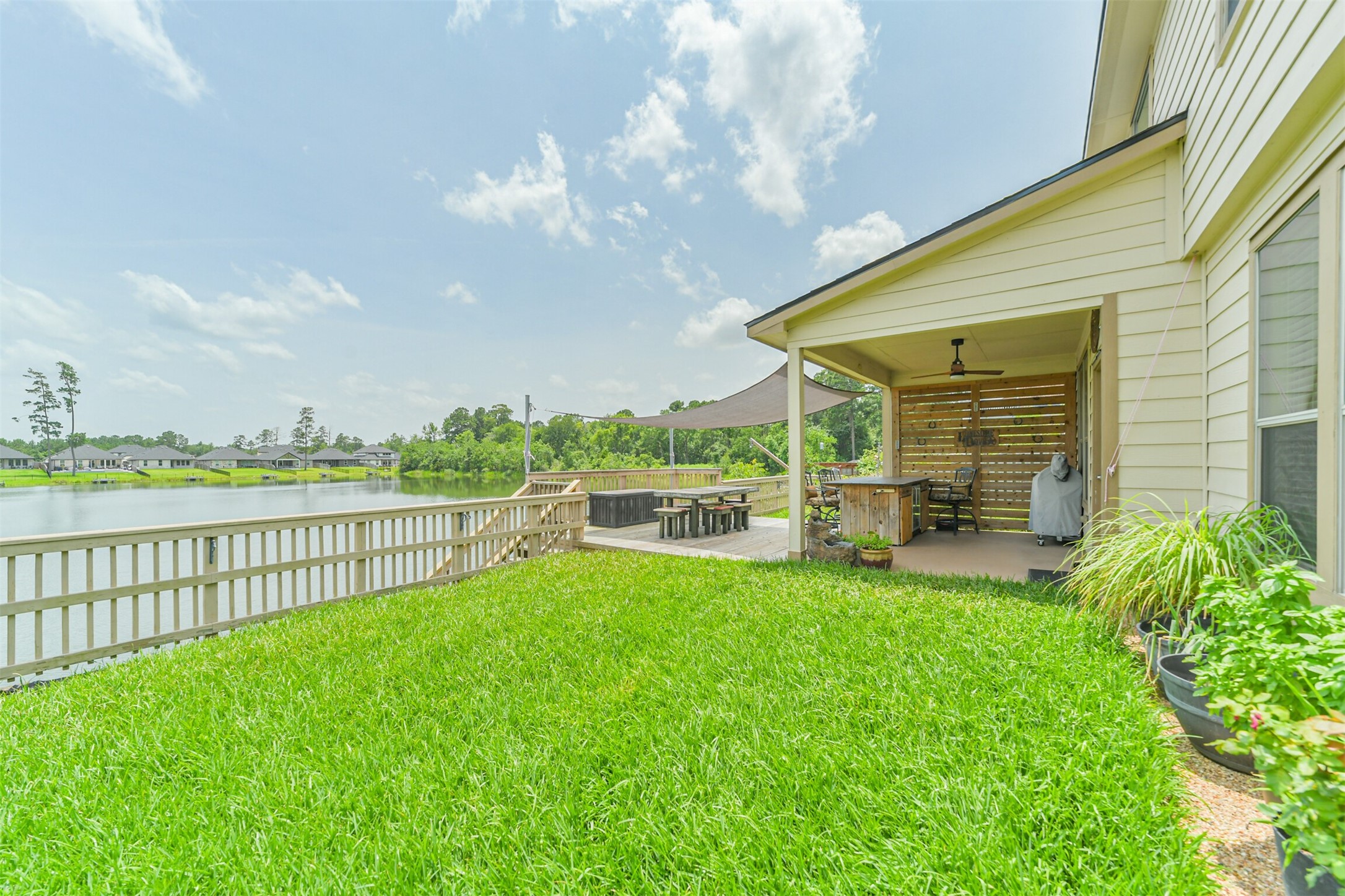 12009 La Salle River Road Conroe, TX 77304 - Photo 43 of 50 a view of a house with backyard and sitting area