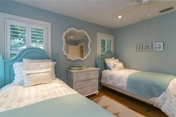 a room with a flat screen tv and a window