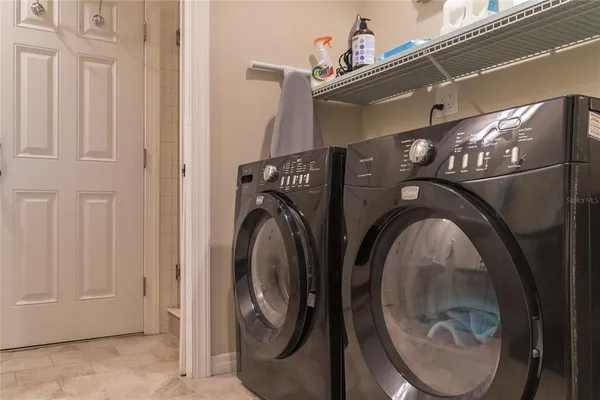 a view of a chairs and table in backyard