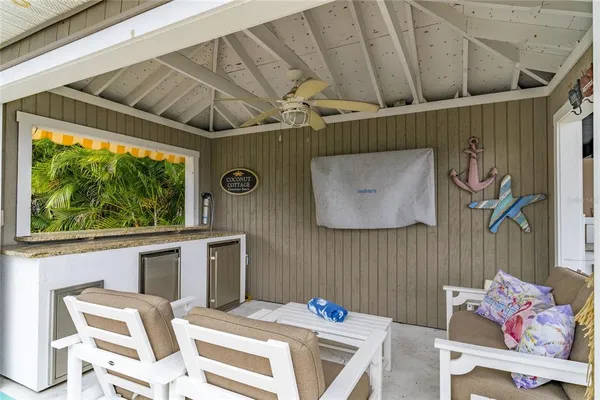 a view of a house with swimming pool and sitting area
