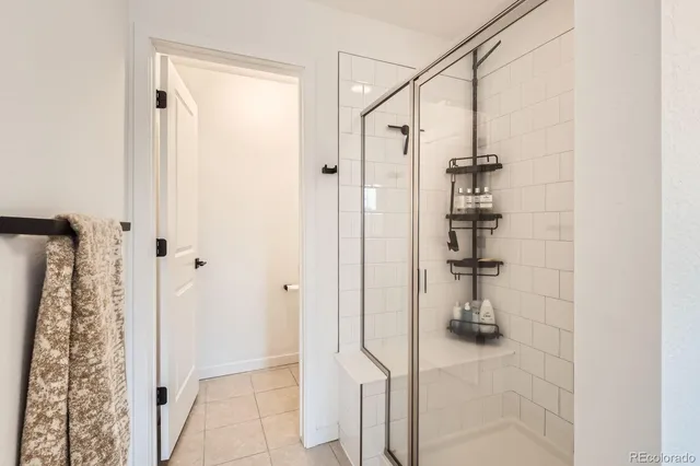a bathroom with a shower and a sink