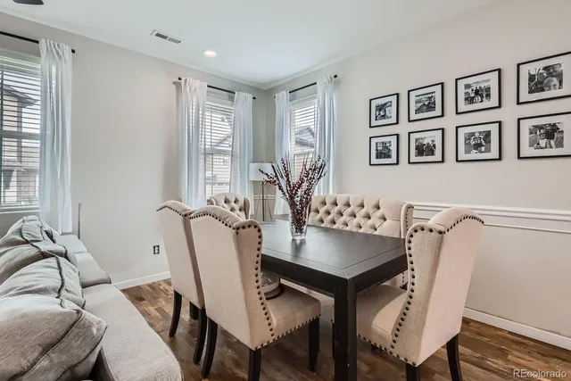 a view of a dining room with furniture and window