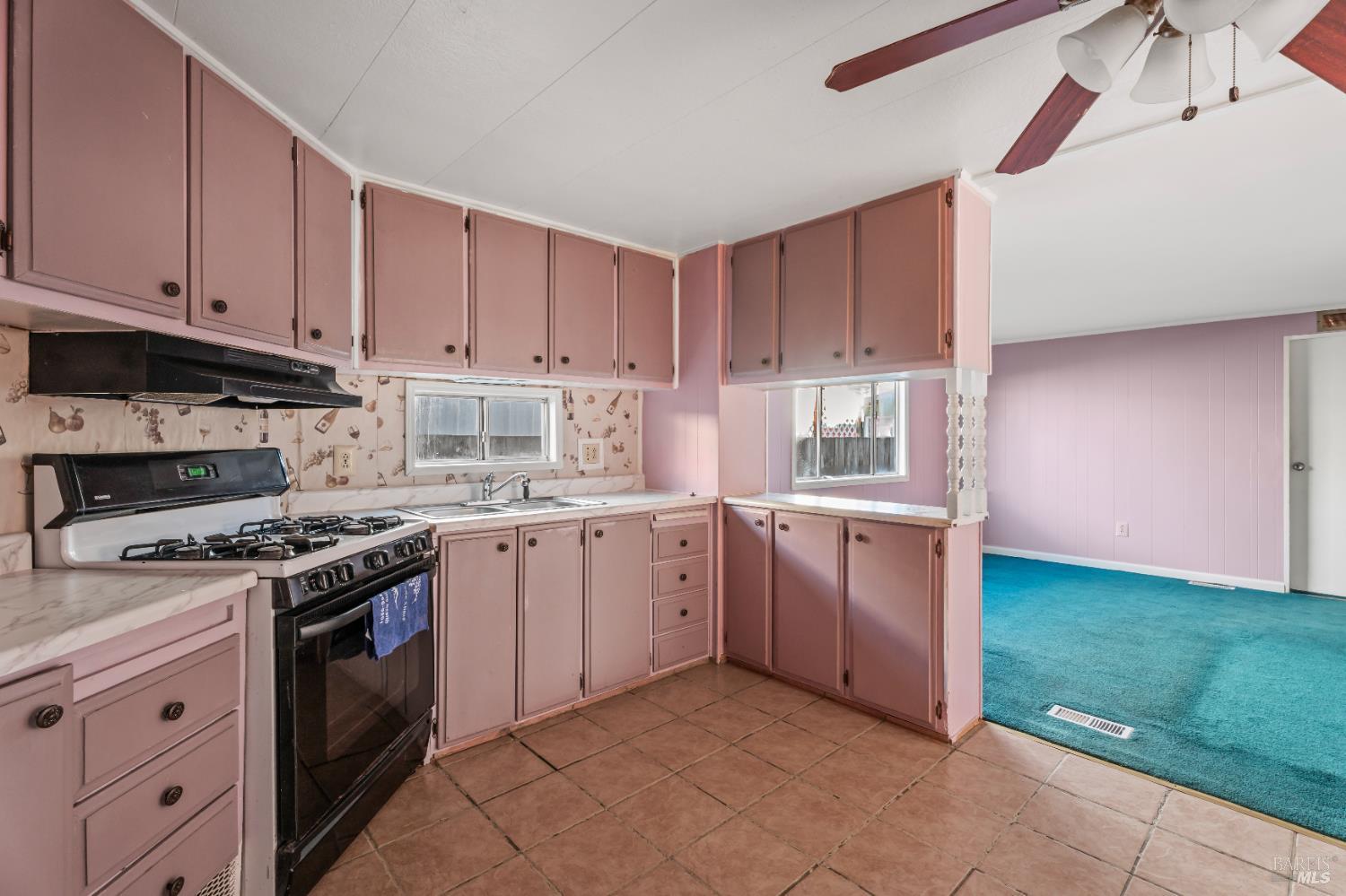 4080 Burke Hill Road, Unit 4 Ukiah, CA 95482 - Photo 8 of 19 a kitchen with a stove sink and cabinets