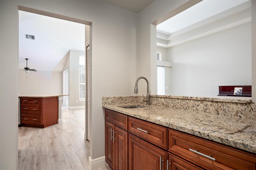 835 Grovesmere Loop Ocoee, FL 34761 - Photo 7 of 27 Butler Pantry between the Dining Room and Kitchen