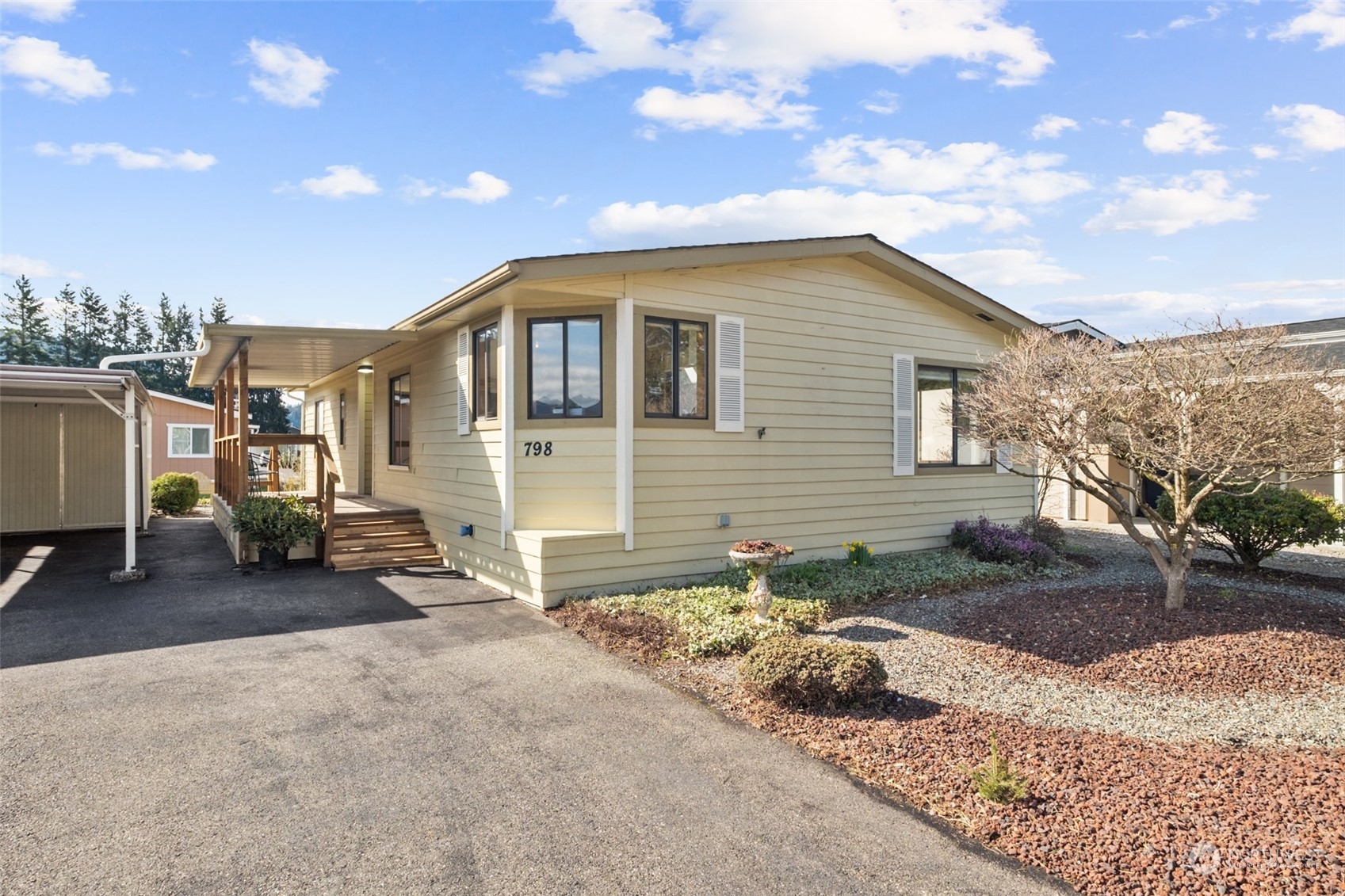 798 Pine Drive, Unit 798 Enumclaw, WA 98022 - Photo 2 of 20 a view of a house with a yard