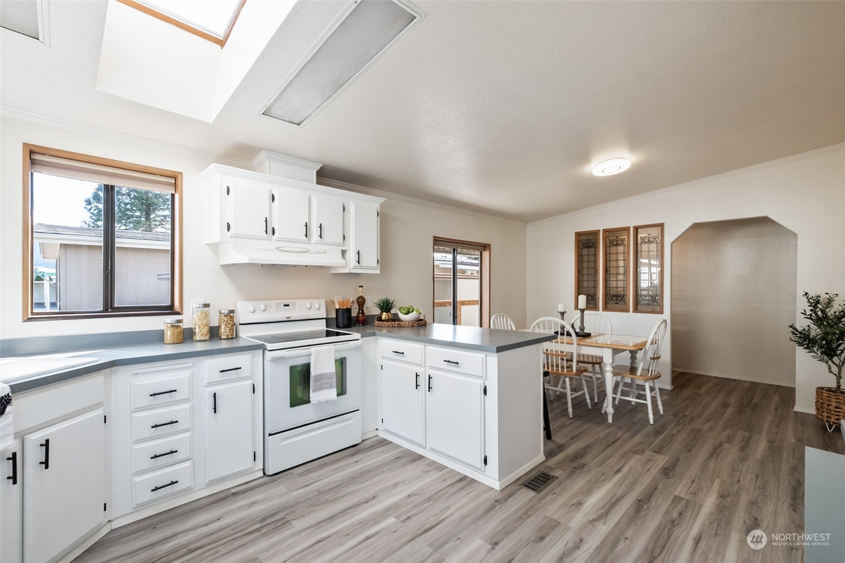 798 Pine Drive, Unit 798 Enumclaw, WA 98022 - Photo 8 of 20 a kitchen with stainless steel appliances a white stove top oven and cabinets