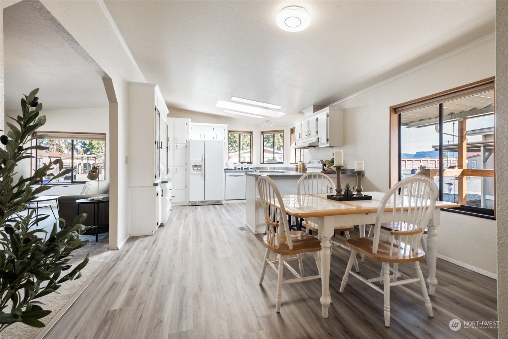 798 Pine Drive, Unit 798 Enumclaw, WA 98022 - Photo 9 of 20 a view of a dining room with furniture window and wooden floor