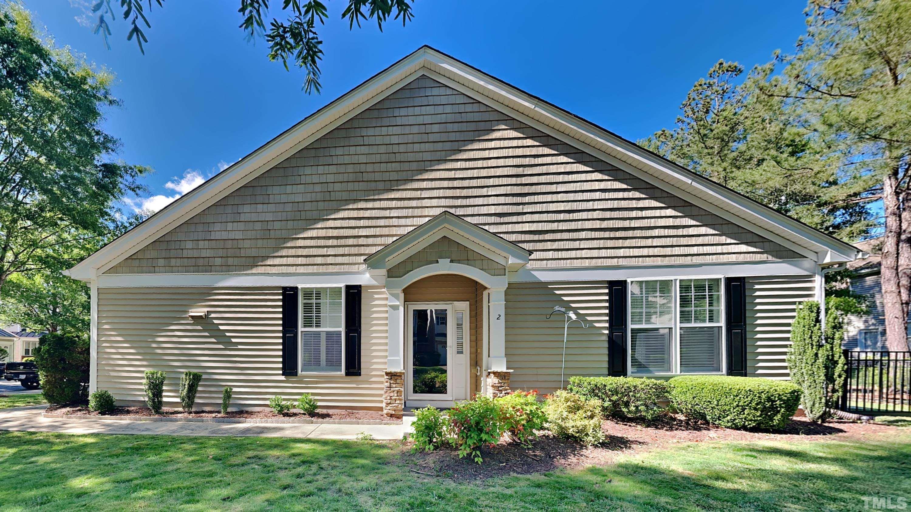 front view of a house with a yard