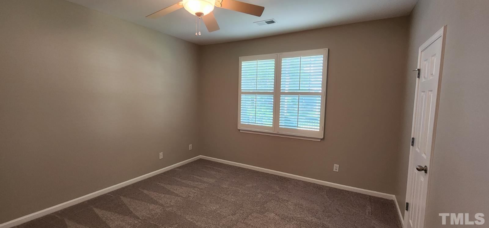 2 Water Garden Way Durham, NC 27713 - Photo 7 of 16 an empty room with a window