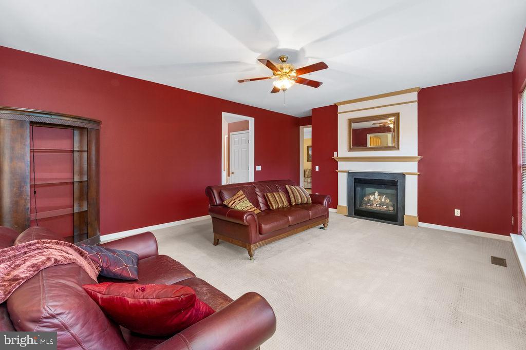 14701 Danton Court Bowie, MD 20721 - Photo 12 of 60 a living room with furniture and a fireplace