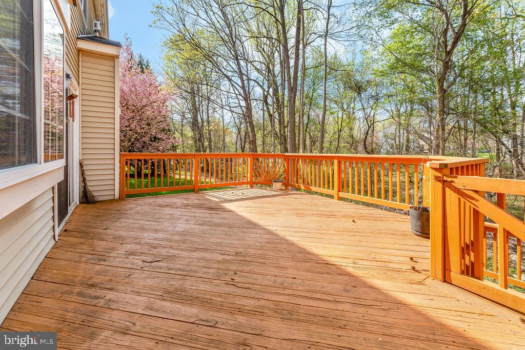 14701 Danton Court Bowie, MD 20721 - Photo 20 of 60 a view of balcony with wooden floor and fence and a trees