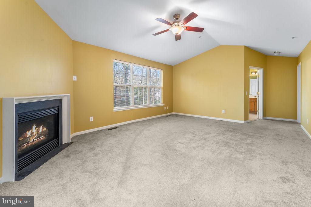 14701 Danton Court Bowie, MD 20721 - Photo 25 of 60 a view of an empty room with a fireplace and a window